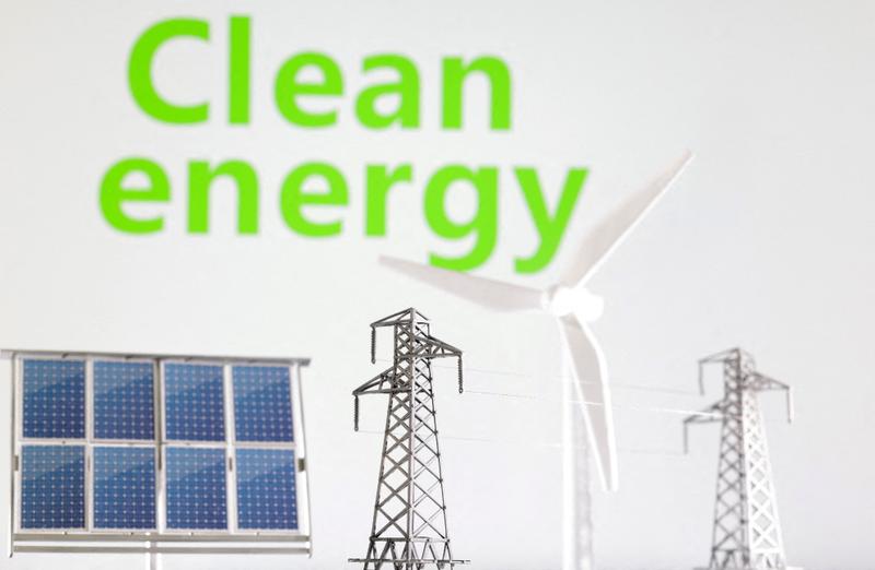 FILE PHOTO: Miniatures of windmill, solar panel and electric pole are seen in front of words Clean energy in this illustration taken January 17, 2023. REUTERS/Dado Ruvic/Illustration/File Photo